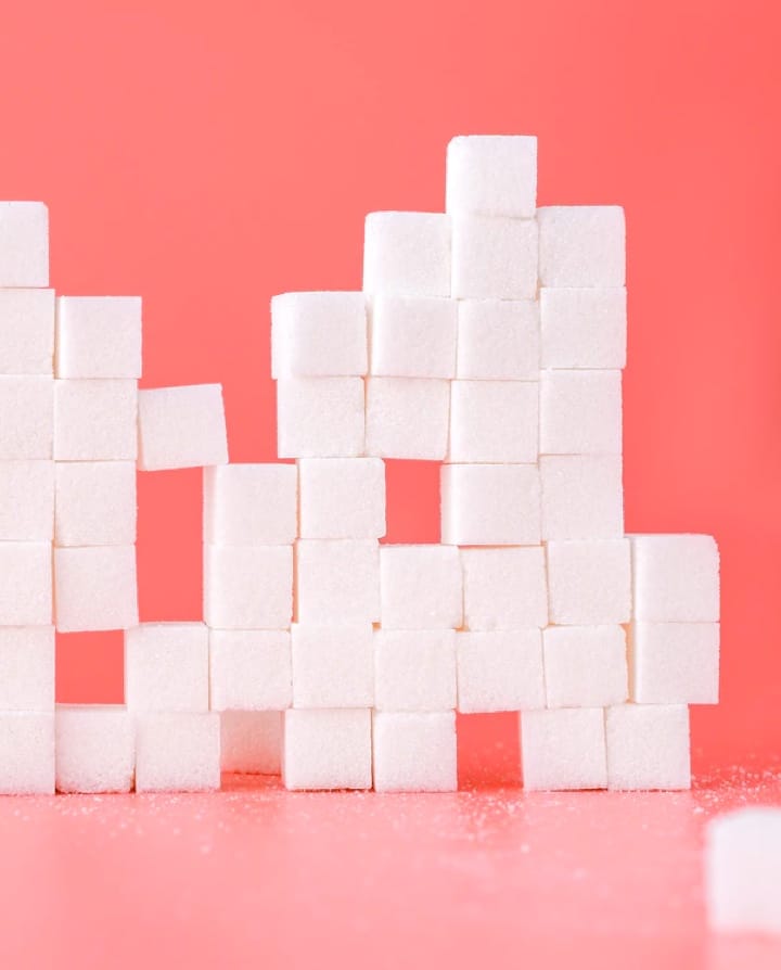 stacked sugarcubes on red background